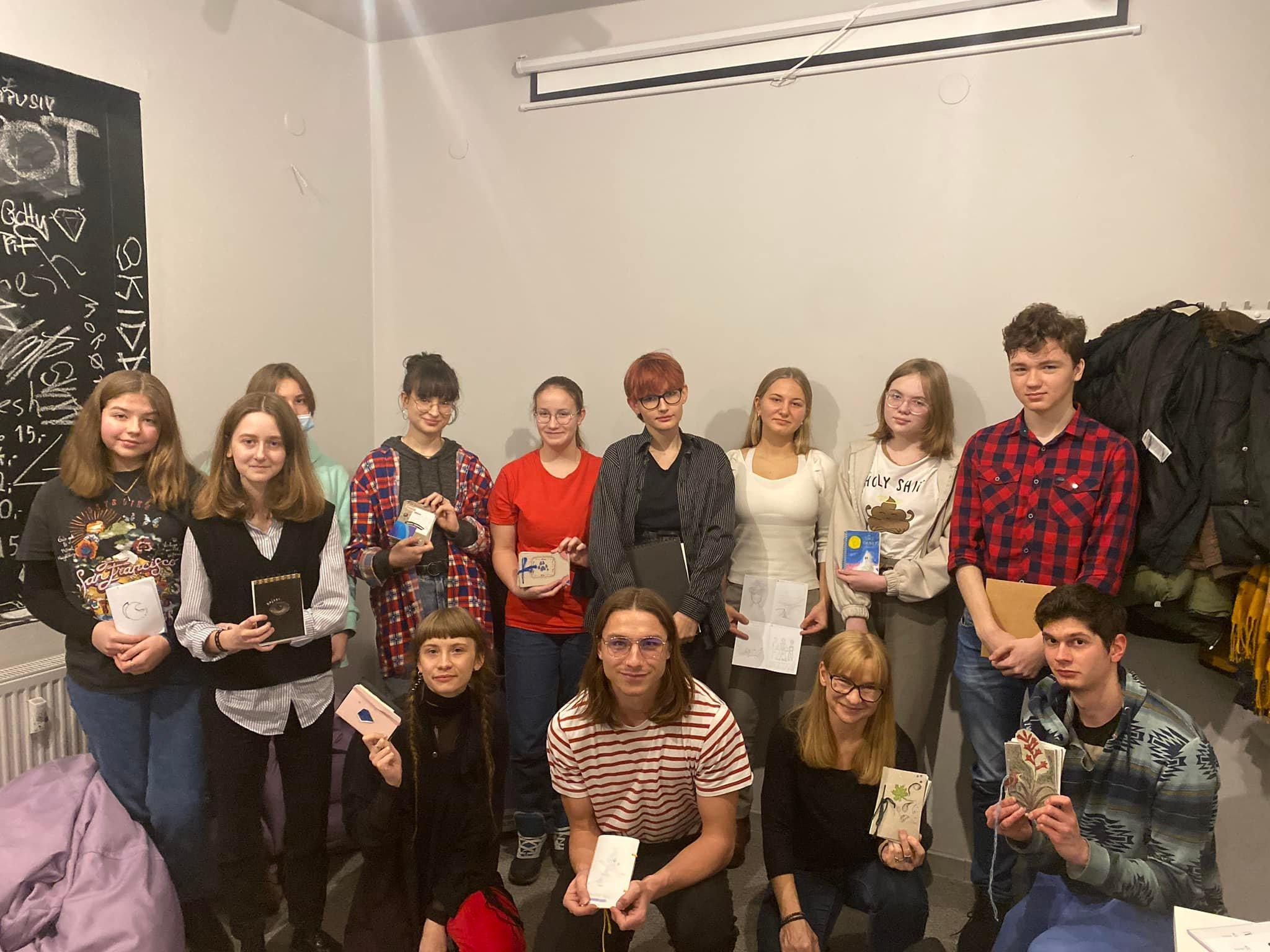 A family gathering in a winter setting with project participants and facilitators.