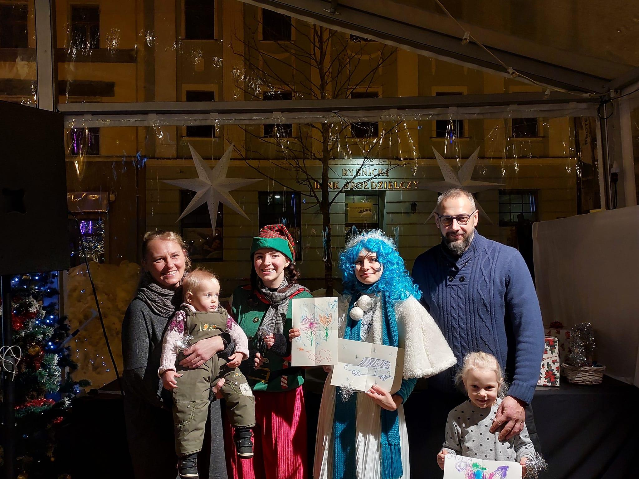 Youth workshop - a group of participants presents their completed work in a room.