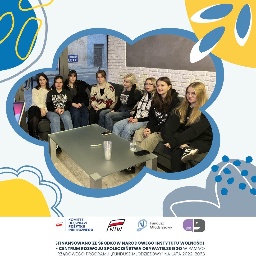 Participants sit in the hall during a presentation and educational project meeting.