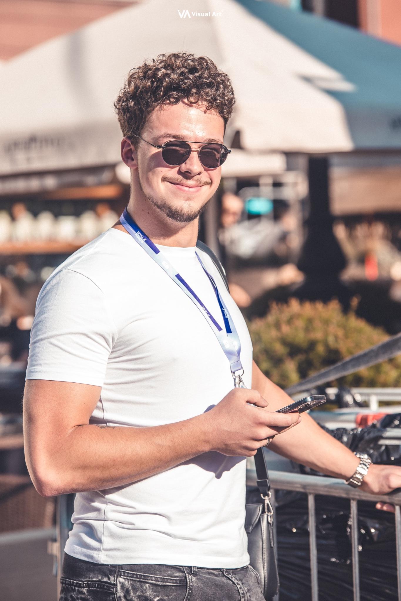 The vocalist sings into a microphone during the project's outdoor concert.