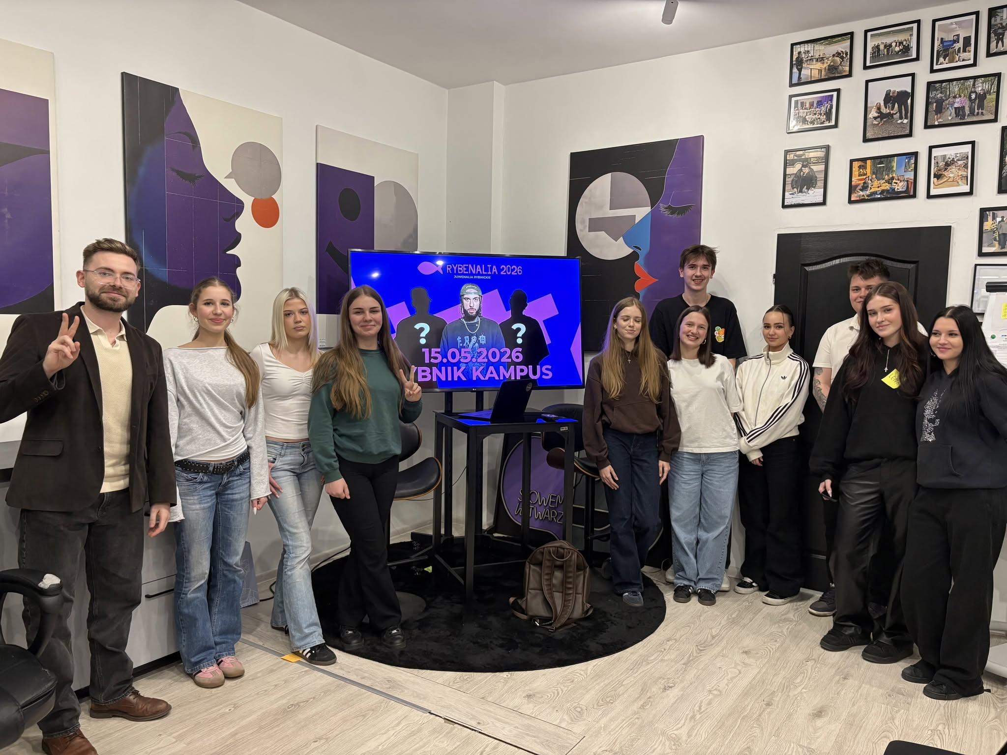 The Rybenalia 2026 team standing beside a screen announcing the event
